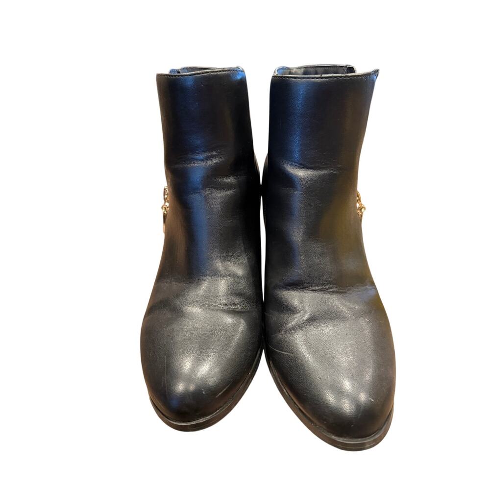 Guess booties with branding on the back.